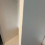 Large white wardrobe with mirrored sliding doors. Image 3
