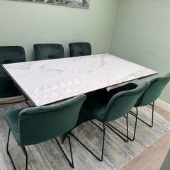Extendable dining table with six chairs
