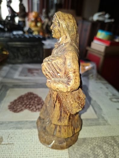 Peasant woman c1950s Wearing a Headscarf and Apron while carrying a bundle of provisions, features detailed facial expressions, textured clothing folds, and a base characteristic of regional decorative collectibles, Postage Available or Collection,