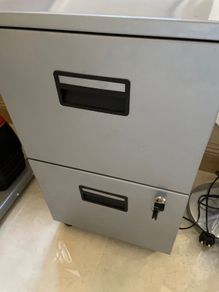 Small grey filing cabinet