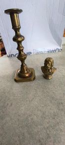 2 BRASS ITMEES-1- Primitive Antique Early Country Brass Push Up 9.5 INCHES Candlestick55.00 euro. 2- Brass Oliver Plunkett Tapper or papper wighte 60.00 euro.