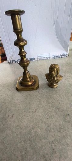 2 BRASS ITMEES-1- Primitive Antique Early Country Brass Push Up 9.5 INCHES Candlestick55.00 euro. 2- Brass Oliver Plunkett Tapper or papper wighte 60.00 euro.