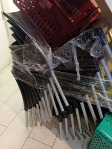 12 black plastic chairs with metal legs