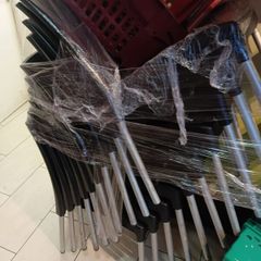 12 black plastic chairs with metal legs