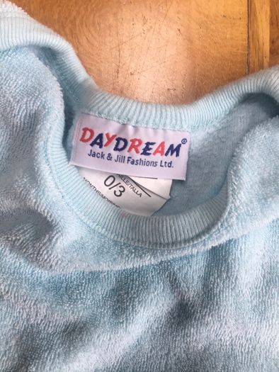 Baby suit with rattles in the toes.  0-3 months.