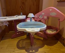 Baby doll play centre with high chair, bath and cot.