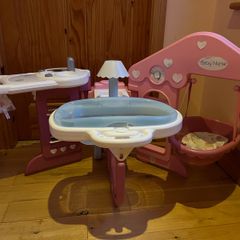 Baby doll play centre with high chair, bath and cot.