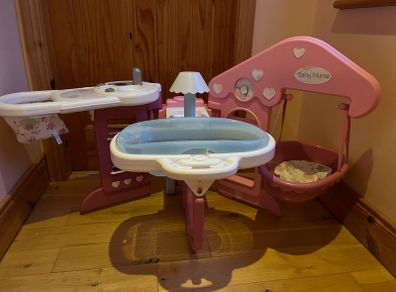Baby doll play centre with high chair, bath and cot.