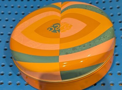 Colourful circular tin box