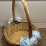 Wicker basket with artificial blue flowers. Image 3