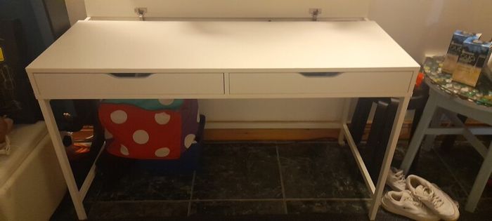 white ikea desk and two chairs