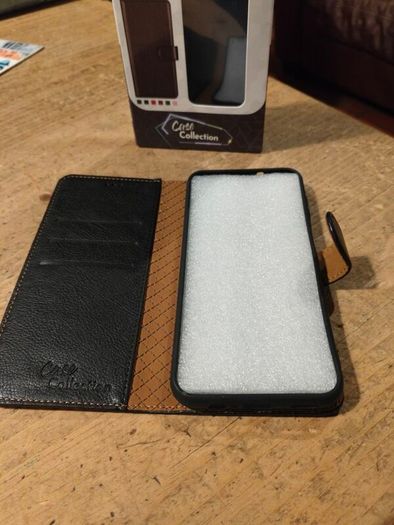 Black Multi functional phone case.  New in box.
