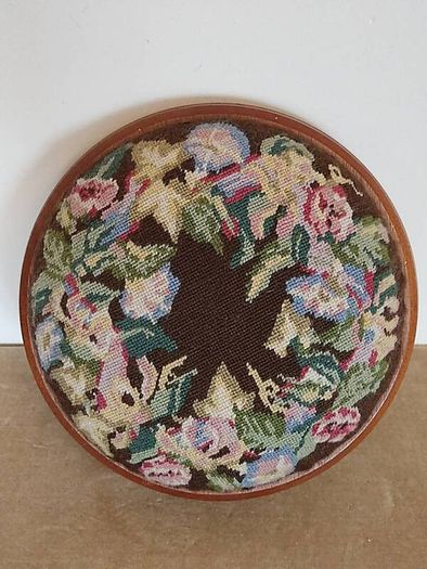 Vintage hand embroidered floral design on wooden base stool,