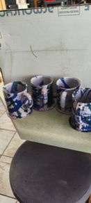 Set of 4 Irish pottery mugs featuring blue and green marbled glazes