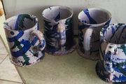 Set of 4 Irish pottery mugs featuring blue and green marbled glazes