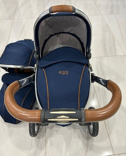 Navy egg carrycot and also Converts to a tandem pushchair
