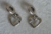 Pandora linked sister hearts split dangle charm. Very good condition hallmarked