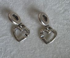 Pandora linked sister hearts split dangle charm. Very good condition hallmarked