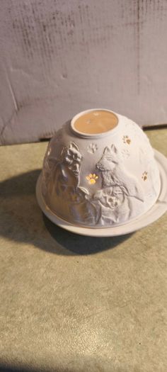 Nordic Lights porcelain tea light holder dome featuring a cat or dog theme.