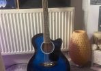Blue acoustic bass guitar