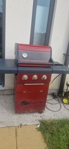 barbecue with full gas bottle
