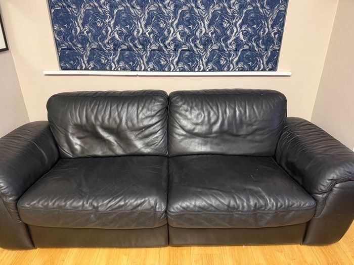 Black leather Natuzzi sofa and two chairs