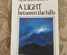 A Light Between The Hills. By Heather Parsons. Illustrated By Don Conroy.a First Edition Paperback In Good Condition   See Photos For Same.