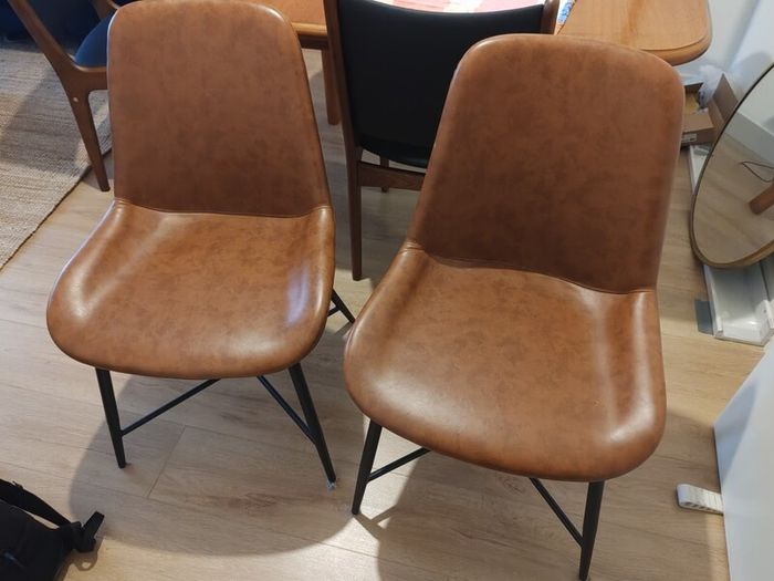 pair of faux leather dining chairs