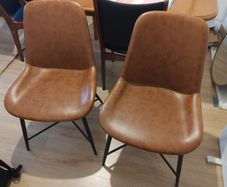 pair of faux leather dining chairs