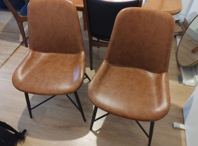 pair of faux leather dining chairs