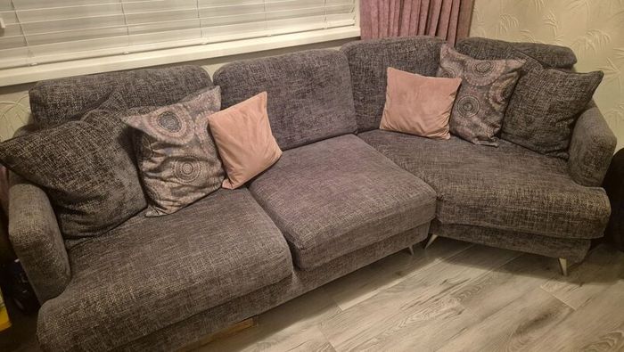 Grey corner couch with 6 matching cushions