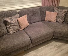 Grey corner couch with 6 matching cushions