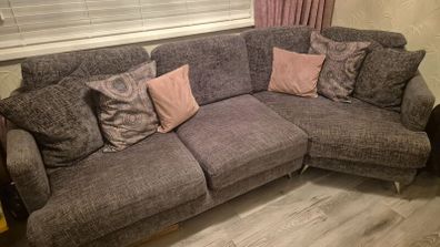 Grey corner couch with 6 matching cushions