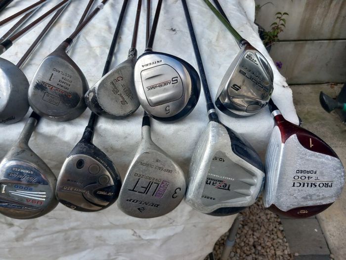 A selection of Golf clubs. Bags and golf balls.