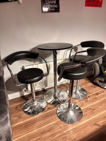 3 bar stools and table