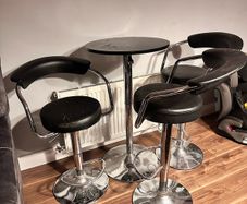 3 bar stools and table