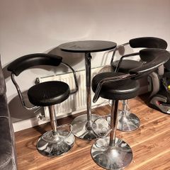 3 bar stools and table