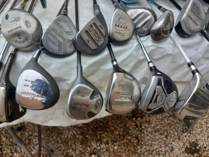 A selection of golf clubs and bags. NOT SELLING SEPARATE