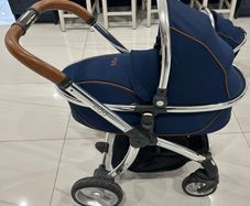Navy egg carrycot and also Converts to a tandem pushchair