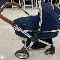Navy egg carrycot and also Converts to a tandem pushchair