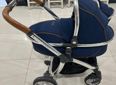 Navy egg carrycot and also Converts to a tandem pushchair