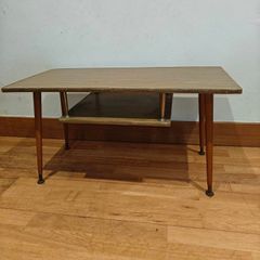 Very cute mid century side table with magazine rack.
