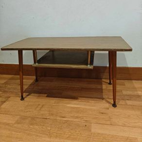 Very cute mid century side table with magazine rack.