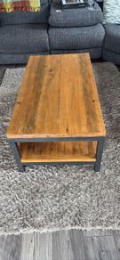 Industrial style coffee table with lower shelf