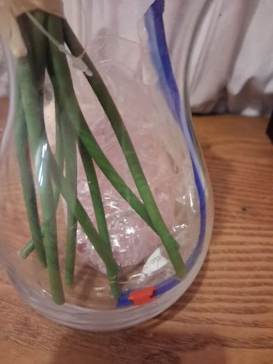 Artificial pink roses and vase