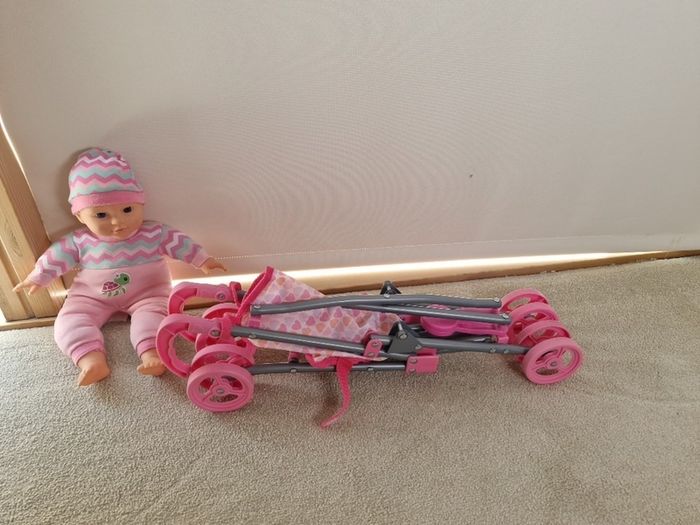 Baby buggy and doll