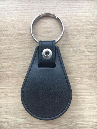 Brand new synthetic leather Isuzu key ring with shopping trolley token/coin