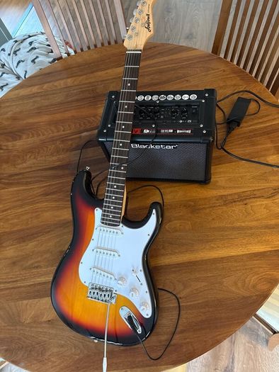 Electric guitar with amplifier