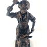 Vintage metal figurine of a blacksmith Image 3