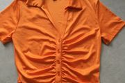 ladies Orange short sleeve top. Size S 10/12